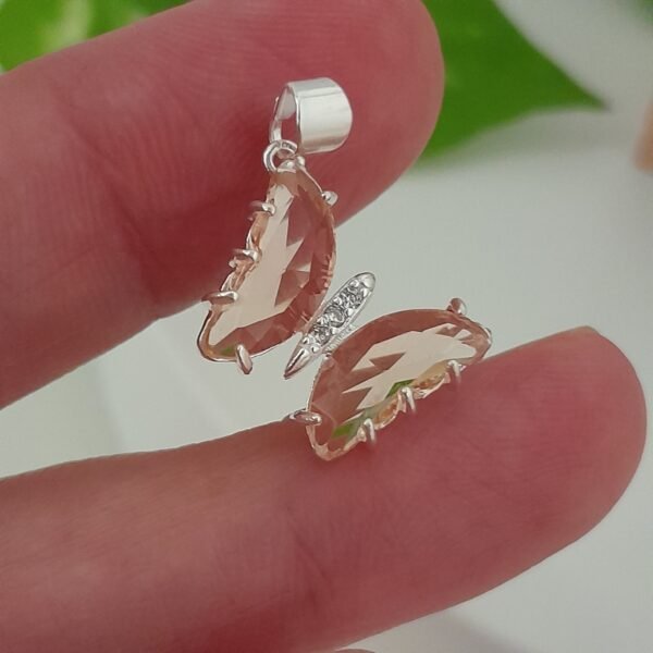 Dije mariposa cristal salmón – Laminados