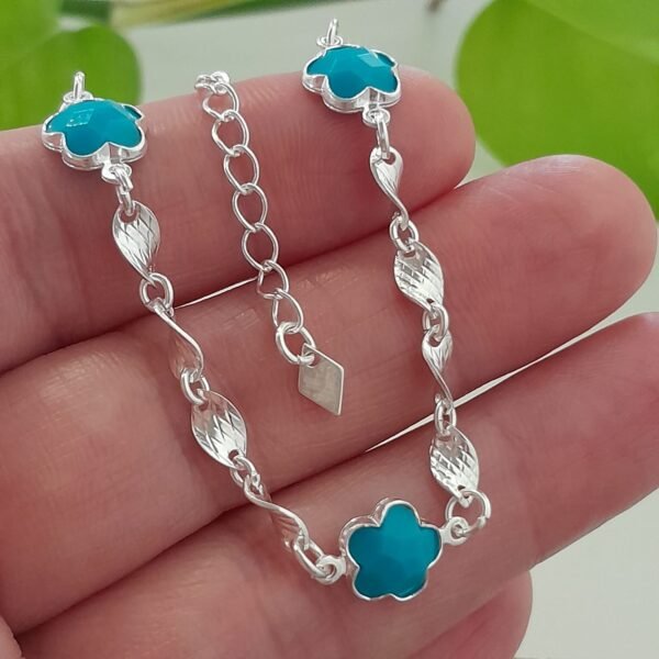 Pulsera laminada flor celeste