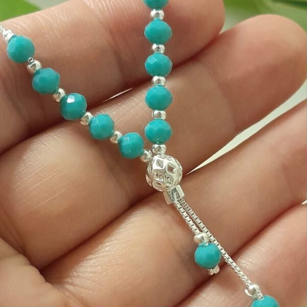 Corbatero laminado con cristal de roca celeste