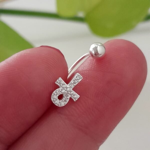 Piercing de pupo cruz egipicia laminada con brillo