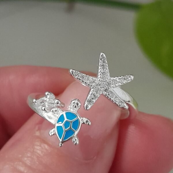 Anillo italiano tortuga celeste esmaltada y estrella de mar con cubic ajustable