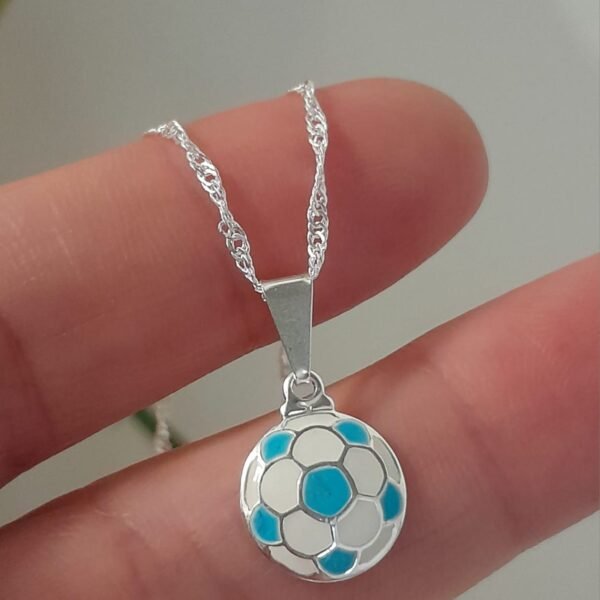 Dije laminado pelota linea mundial