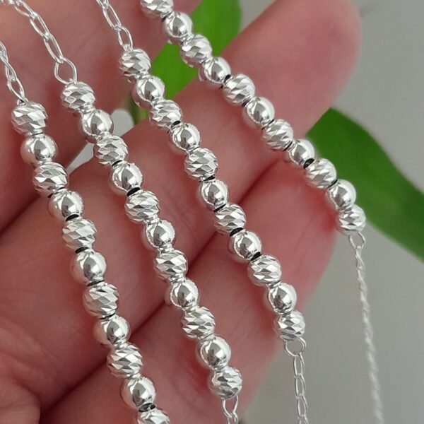 Pulsera italiana con bolitas caladas