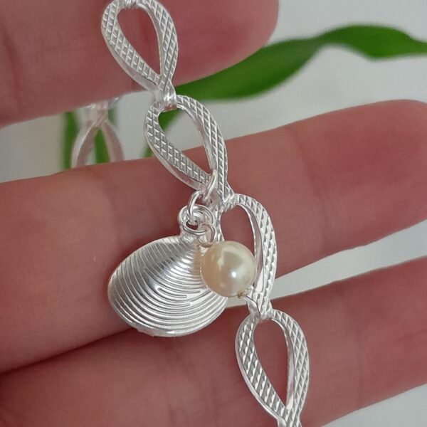 Pulsera laminada caracola con perla